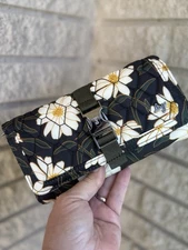 Lug Autumn Daisies Throttle wallet. Exterior buckle with click lock detail