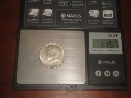 1965 Kennedy Half Dollar. 40 % Silver. AU judge photo and weight