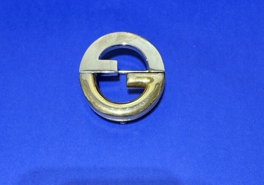 Boucle de ceinture vintage Gucci Italie ton or et ton argent logo GG