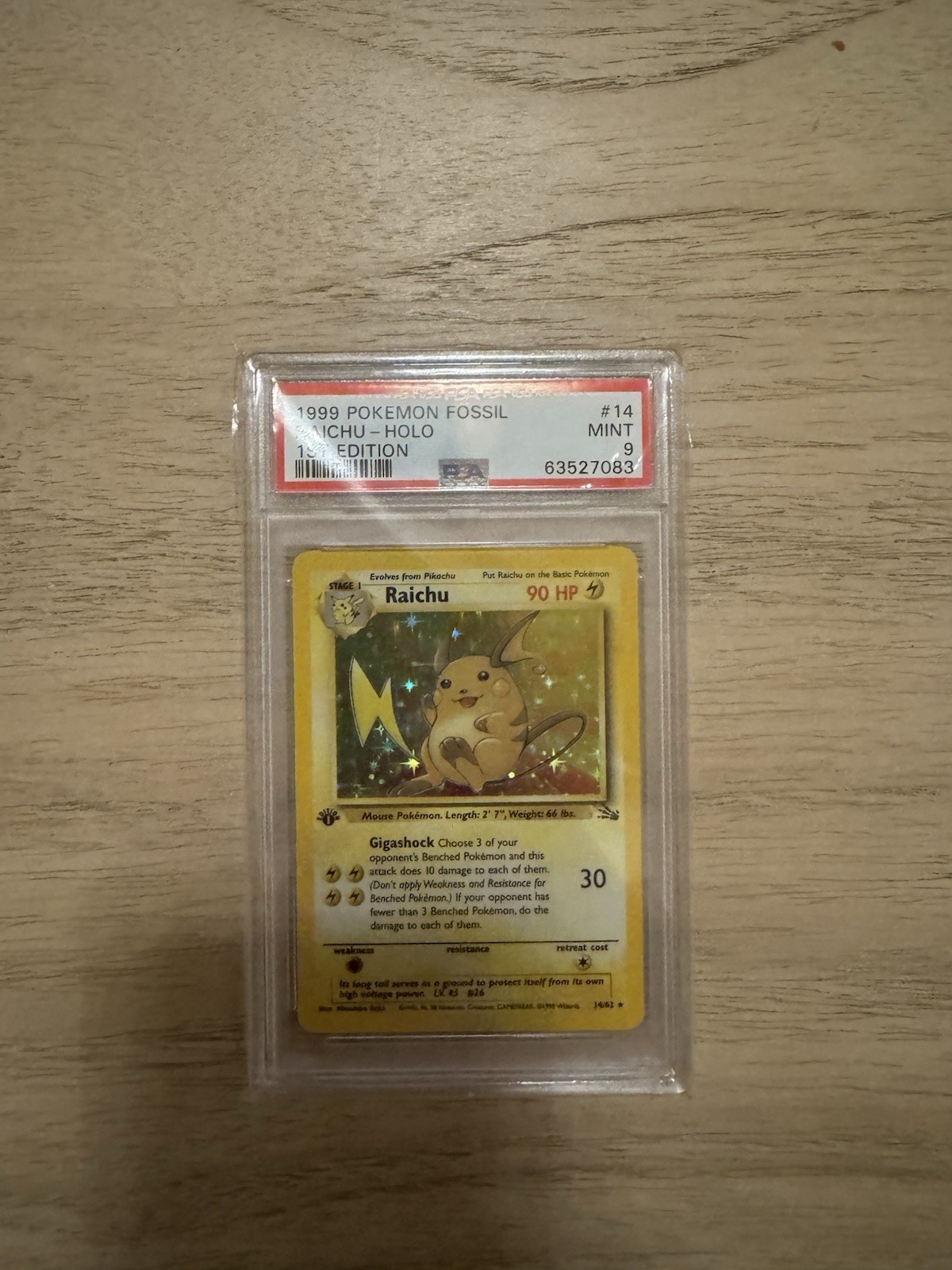1999 Pokemon Fossil 1st Edition Raichu Holo PSA 9 Mint 14/62