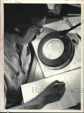1975 Press Photo Dr. Charles Gehring studies historical document in New York