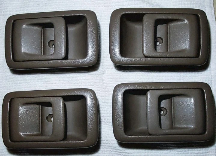 Juego de 4 manijas de puerta interiores Toyota 4runner 98 OEM genuinas usadas Foto 2 de 3