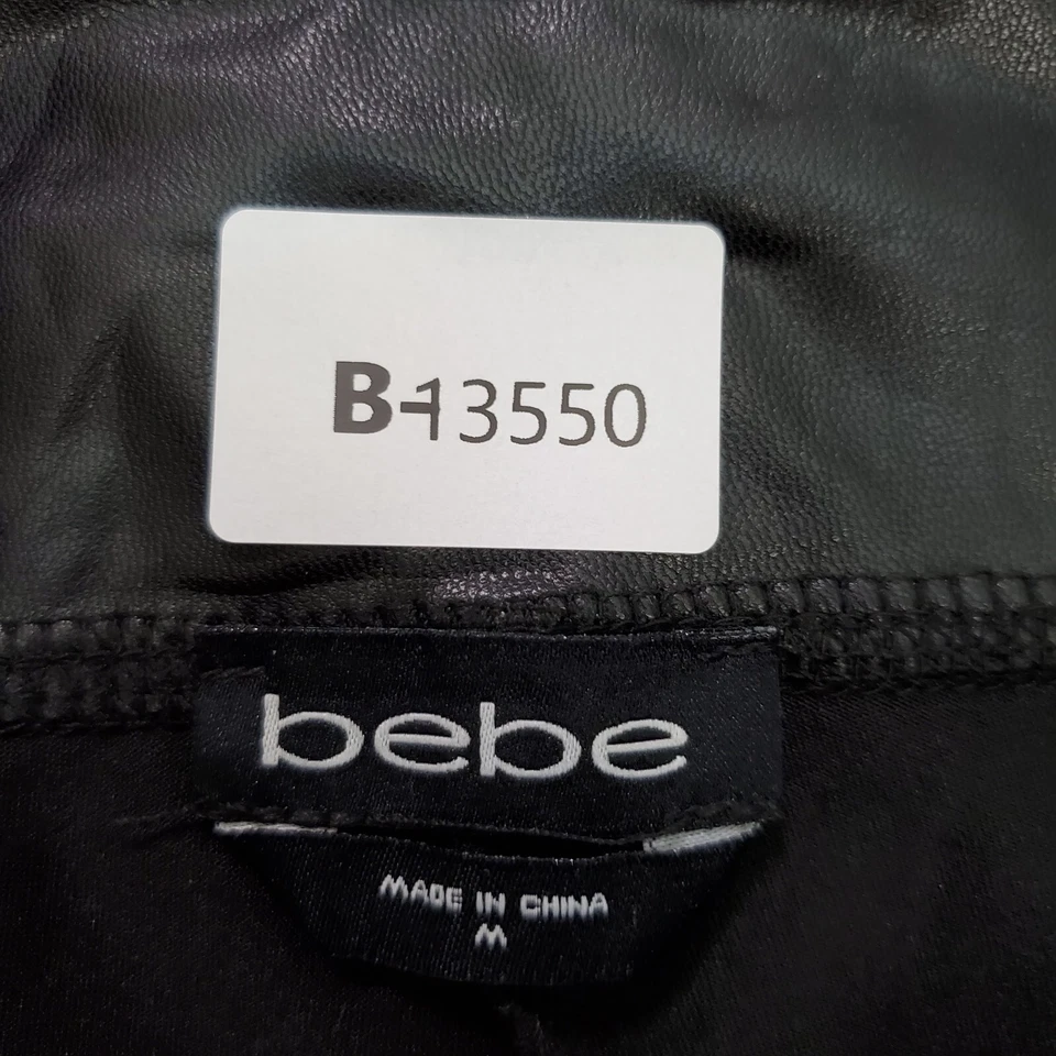 Pantalones Cortos Bebe Mujer Medianos Negros Imitación Cuero Motociclista Elastizados Logo Estrás Foto 2 de 4