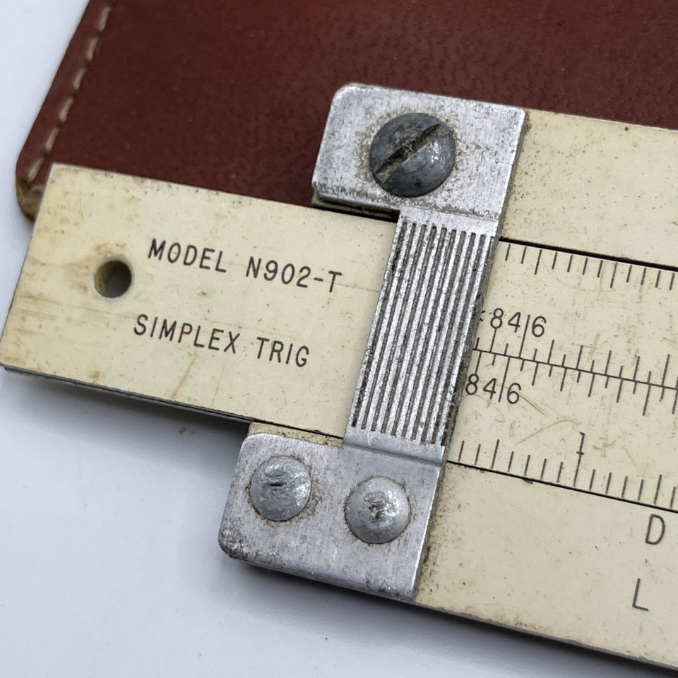 A genuine pre-digital computing tool — this 10" Pickett trig slide rule with its original leather case is exactly what engineers used before calculators existed.