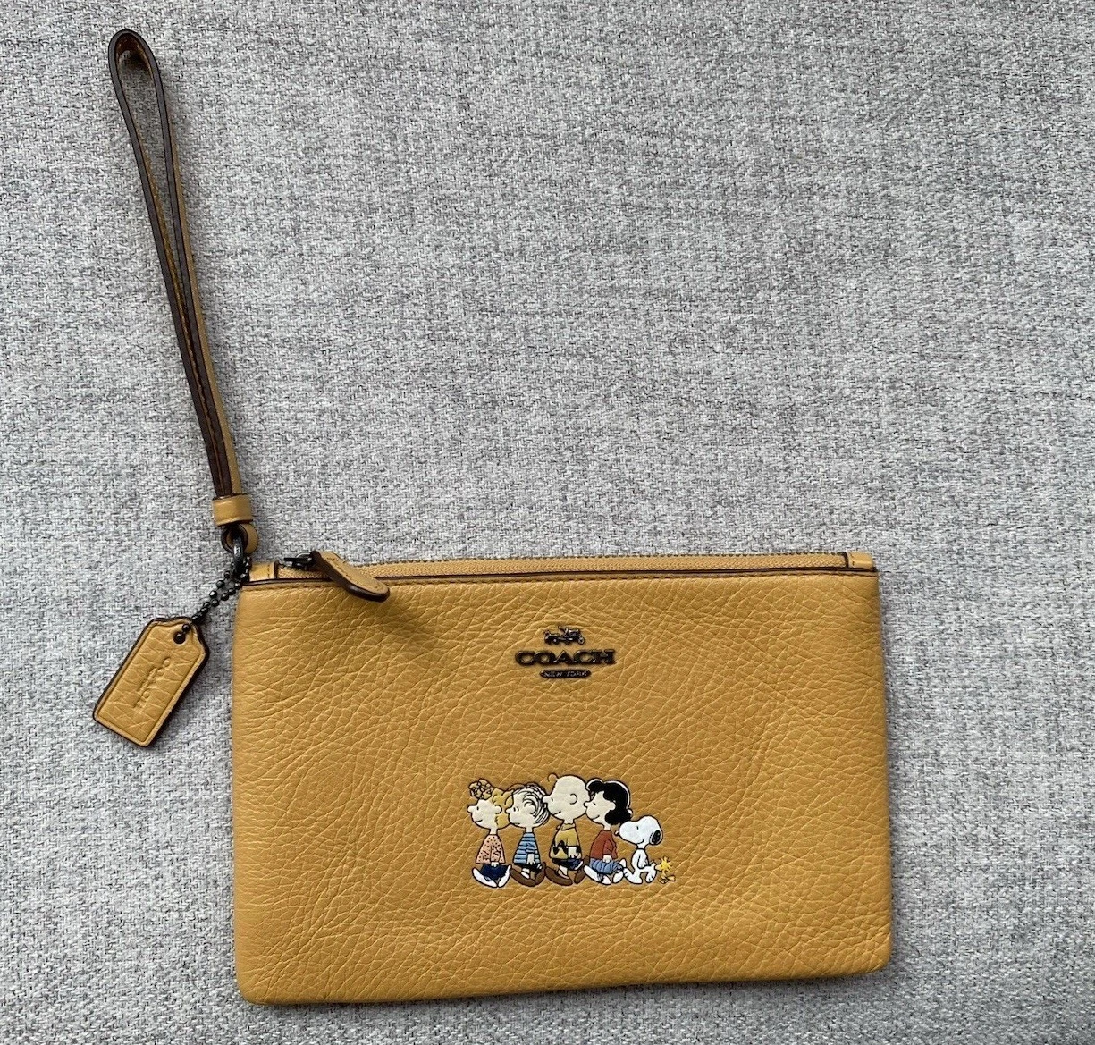 Coach Peanuts borsa da polso in pelle gialla Charlie marrone Snoopy & Gang usata in ottime condizioni!