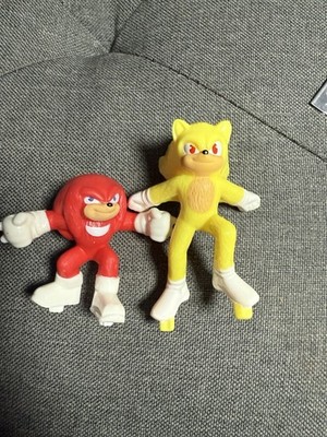 action figures of Super Sonic and Knuckles from the Sonic the Hedgehog franchise