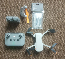 DJI Mini 2 4K Drone + Controller+ 2 DJI batteries+charger+ spare blades
