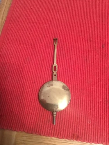 Antique Vintage Brass Mantel Clock Pendulum and suspension arm weighs 90 grams .
