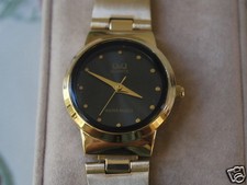 New Q Q by Citizen Gold Tone Lady Dress Watch w/Black Dial