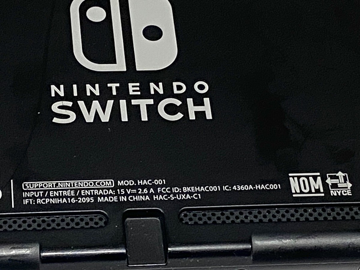 Nintendo Switch Gray Console with Neon Red and Black Joy-Con