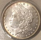 1880-O Morgan Silver Dolllar $ Mid Grade AU white, luster 360° gold rim obv/rev.