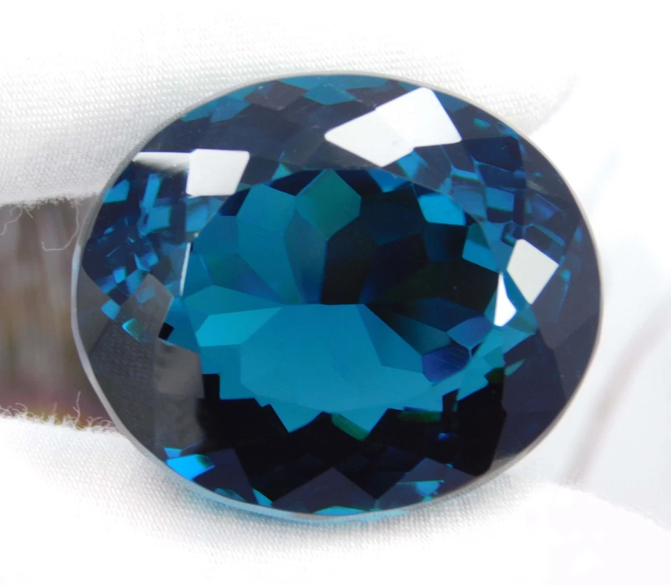 Piedra preciosa de corte ovalado granate tsavorita azul natural Kenia 128,90 quilates certificada Foto 2 de 4