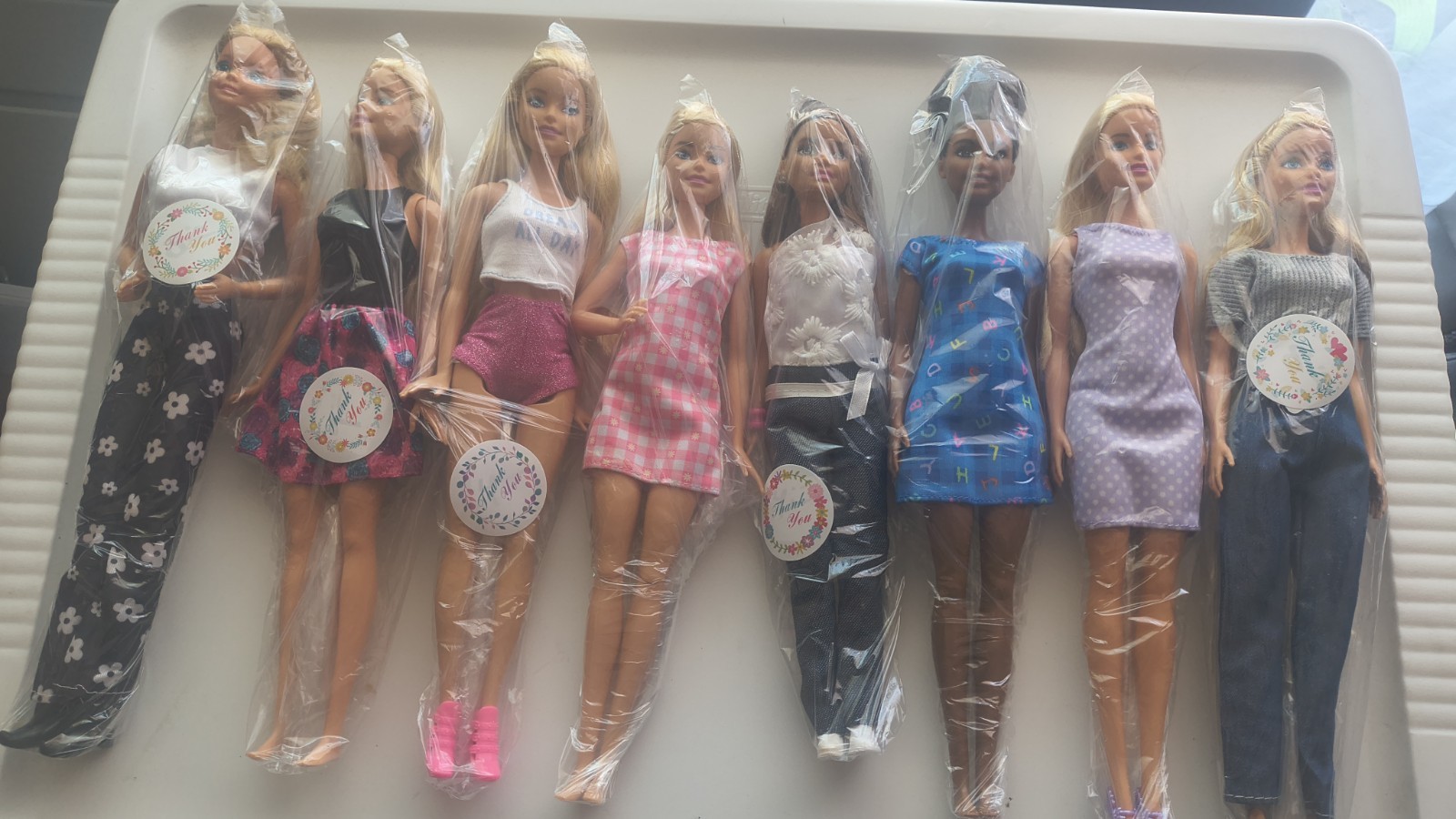 8 Barbie dolls, different models and years, excellent condit
