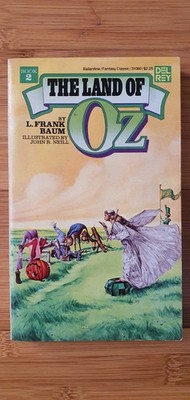  THE LAND OF OZ , Written by L.FRANK BAUM