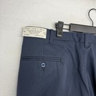 Vintage pleated trousers, blue with white stitching, front button closure, belt loops, and visible “Made in U.S.A.” label.