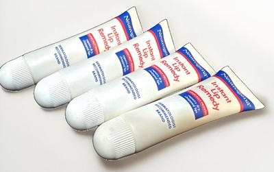 4 neutrogena instant lip remedy 0.5oz ea scuffed exterior 