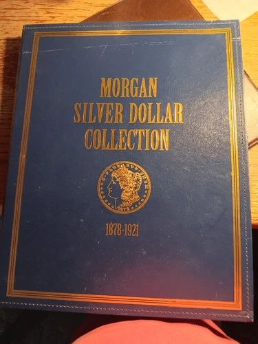 One Morgan Silver Dollar And One Piece Silver Dollar Collectors Albums
