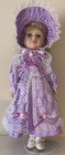 Unbranded Porcelain Collectible Doll with Stand Purple Dress and Bonnet — photo 1