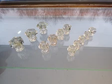 12 piece lot of vintage clear glass drawer / cabinet pulls; 3 grouped sizes.