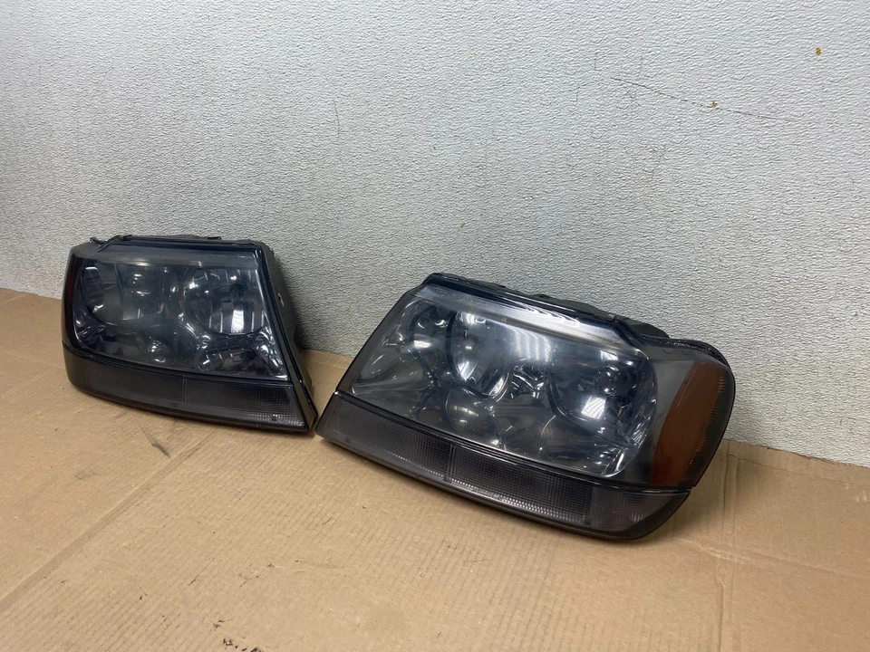 Juego de faros halógenos negros izquierda+derecha Jeep Grand Cherokee 1999-2004 R6880 DW Foto 2 de 4