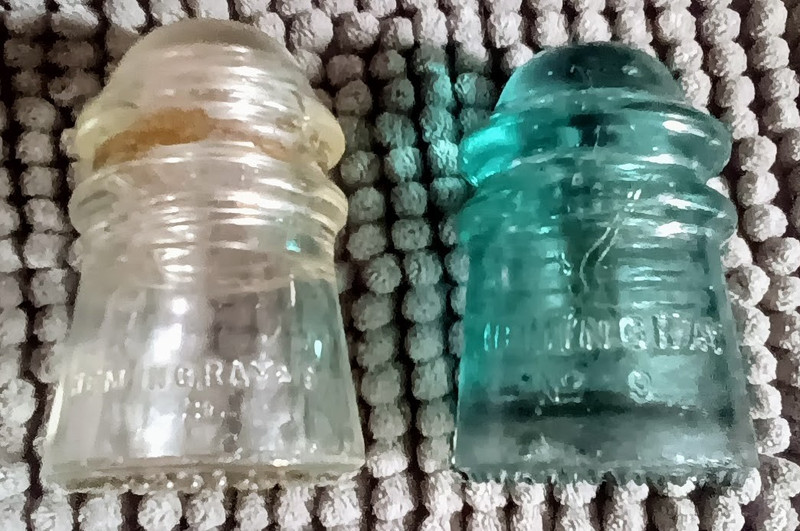 Lot of 2 Vintage Embossed Glass Insulators Aqua & Clear/Amber Tint