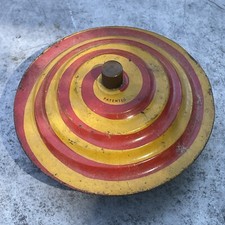 Antique Tin Spinning Top Saucer Red Yellow Swirl  Ringing Noise as it spins.