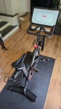 Peloton Exercise Bike 1st Gen with Upgraded Ergon Saddle & Official Peloton Mat