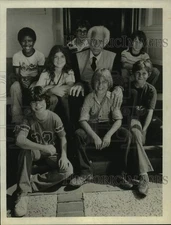 Press Photo Elderly Man Sits With Children - sap53837
