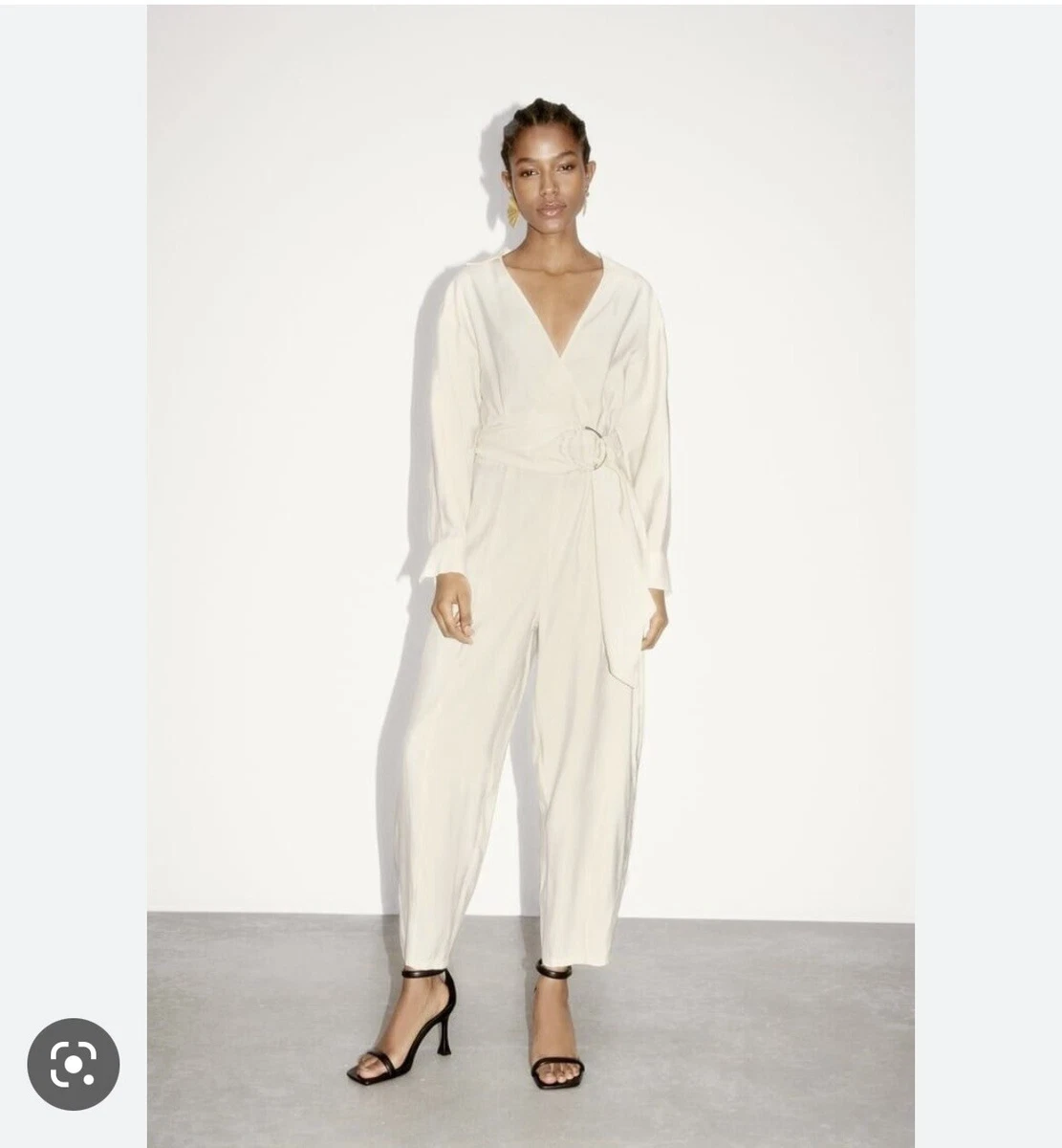 White jumpsuit with gold belt hotsell