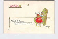 PPC Postcard Christmas Greetings Wall Artist Boy Girl Armchair Reading Paper Gol