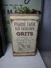 Handmade Primitive style Grits box with home-spun ribbon and sprigs of greenery