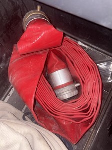 Red Fire Hose Rolled Up with Metal Couplings, Firefighting Hose