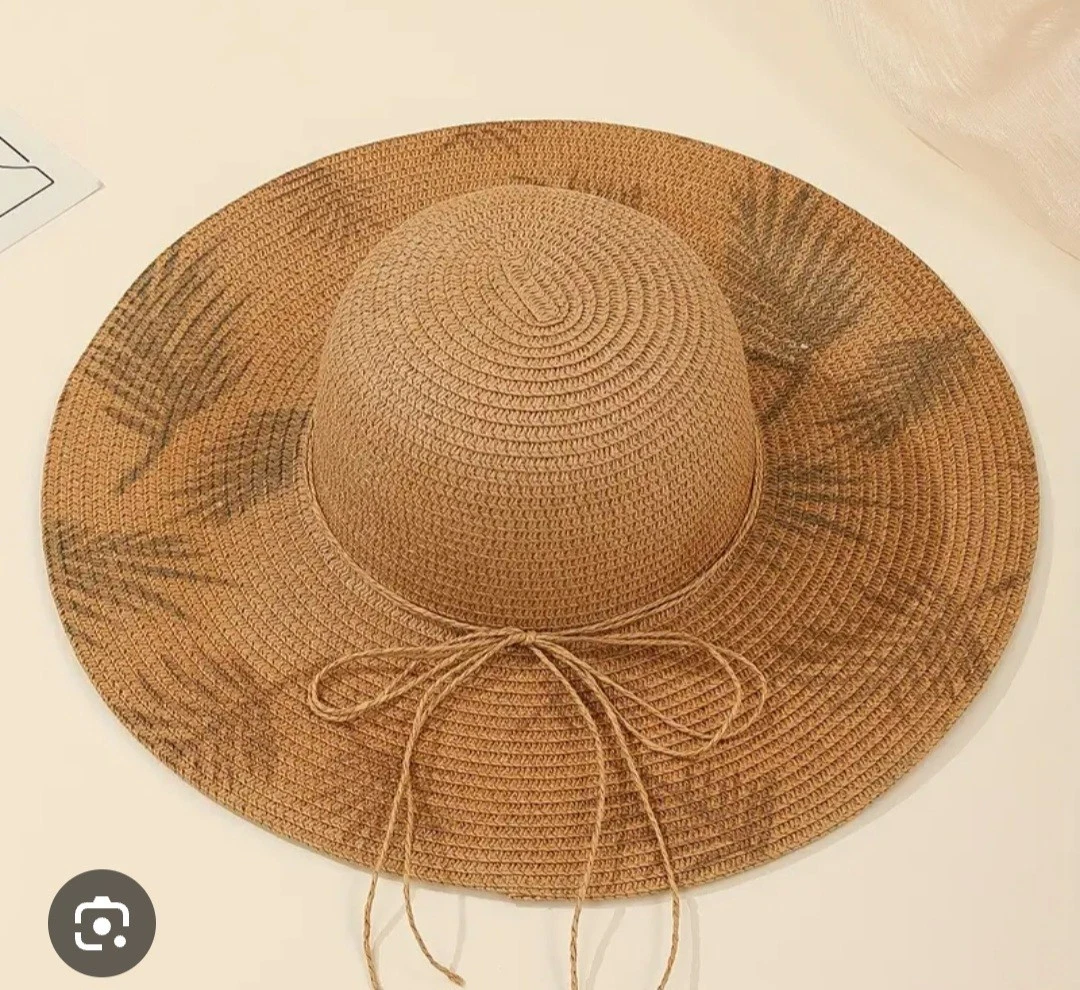 Wide-brimmed beach or field hat. Made mainly of straw.
