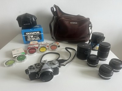 Olympus OM-1 Komplettset mit 4 Zuiko Objektiven (50mm, 21mm, 24mm, 135mm) +Zubehör