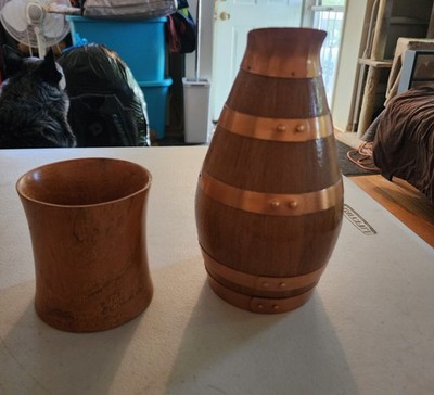 oak barrel-style pitcher with copper bands often used for wine with One Cup.