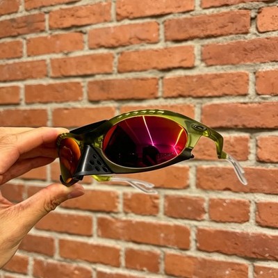 Oakley Plantaris Travis Scott OO9437 Sunglasses Clear Green Frame Ruby Lenses