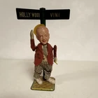 Vintage Tin Toy Character Figure at Hollywood & Vine Street Sign