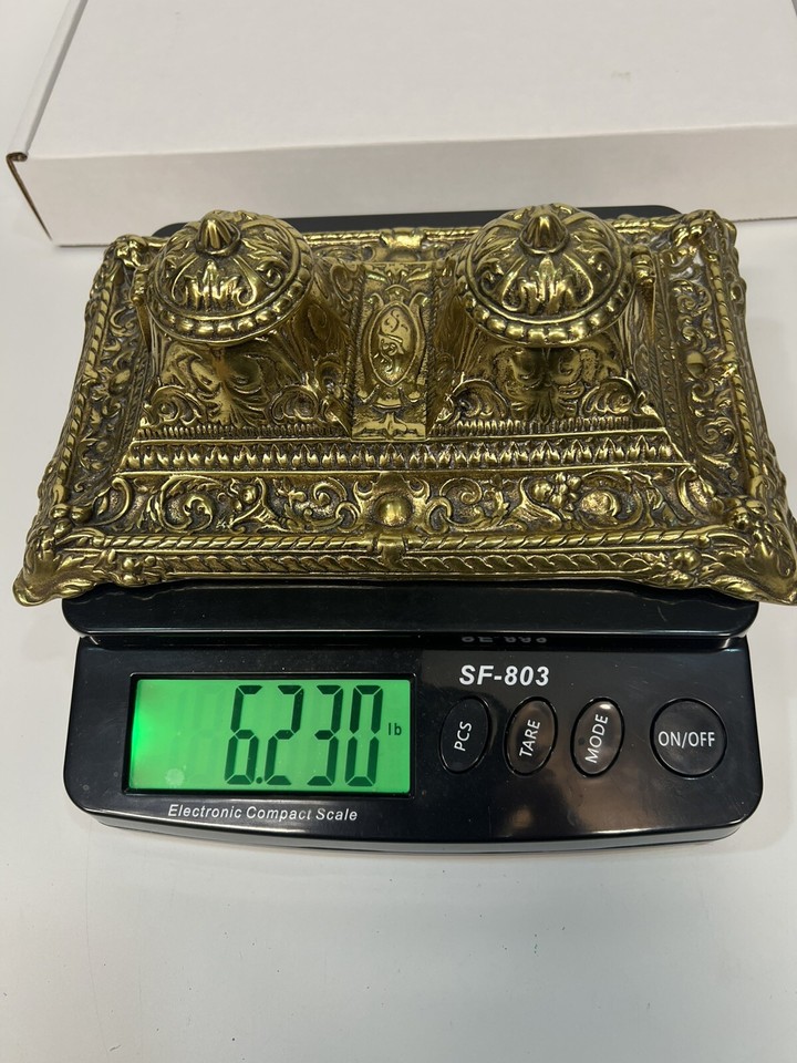 A never-used, over 6-lb solid brass French double inkwell stand — genuinely heavy, genuinely old, genuinely the kind of thing you find once and never again.