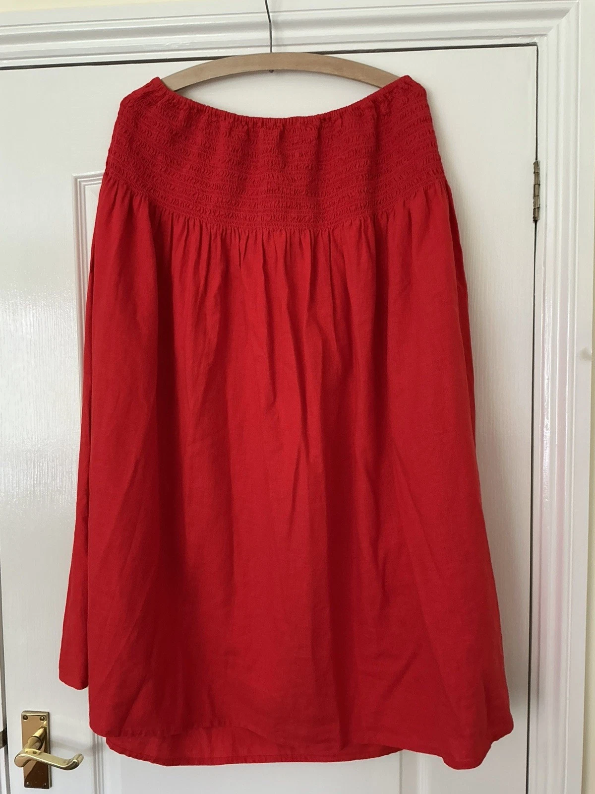 Marks & Spencer pull on smocked waist skirt tomato red. Size 20 Length 33"