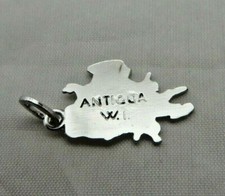 Vintage Antigua West Indies charm 1970s Silvertone island shaped carribean