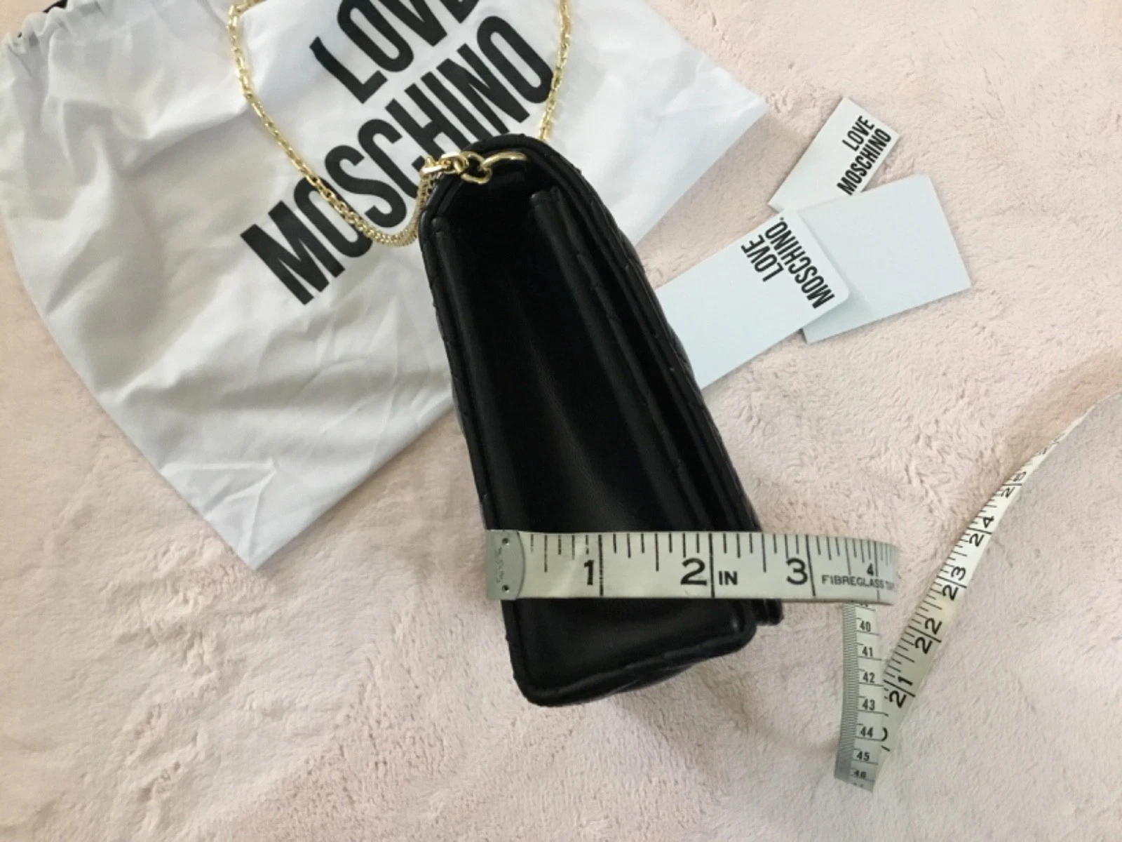 Love Moschino Borsa pochette trapuntata a tracolla con tracolla a catena nero oro