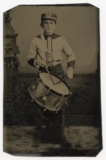 Post-Civil War tintype of young man in uniform holding drum