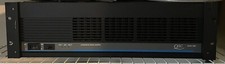 Qsc Model 1200 stereo amplifier with rack mount.