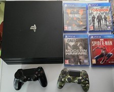 Sony PS4 PRO 1TB Console (CUH-7216B)- Black. Two genuine controllers and 4 games