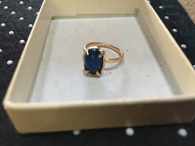 Gold toned ring with plastic blue Costume