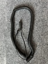 telephone headset adapter cable, commonly a Plantronics HIC-1 or similar