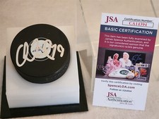 CHARLIE LINDGREN signed CAPITALS puck JSA COA