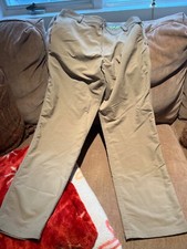 Youth XL Under Armour Loose all season gear pants with mark on front right leg