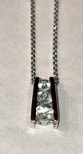 3 stone aquamarine-color pendant set in "925 FAS" sterling silver on 18" chain