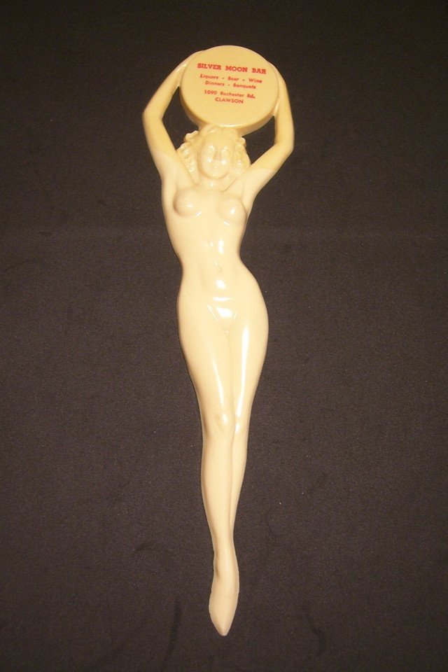 A single vintage swizzle stick from the Silver Moon Bar featuring a naked lady — cheeky, collectible, and a perfect capsule of mid-century cocktail culture.